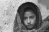 <p>Nilo Kalan, Punjab, India, February, 1997<br />
Huddling for warmth in a corner inside her home, this young Jat girl appeared quite oblivious to her poverty.</p>

