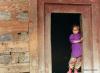 <p>Rangri Village, Kullu, H.P., India, July, 1998<br />
Framed in a ‘made-to-order-door’, this little girl admiringly looks on at her father working in the paddy fields.</p>
